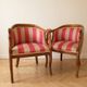 Pair of gondola armchairs with swan neck in Louis XV style, striped pink fabric.