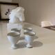 Set of 4 vintage egg cups in white porcelain with a gold rim.