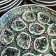 Set of 12 plates and an oyster dish or other in majolica.