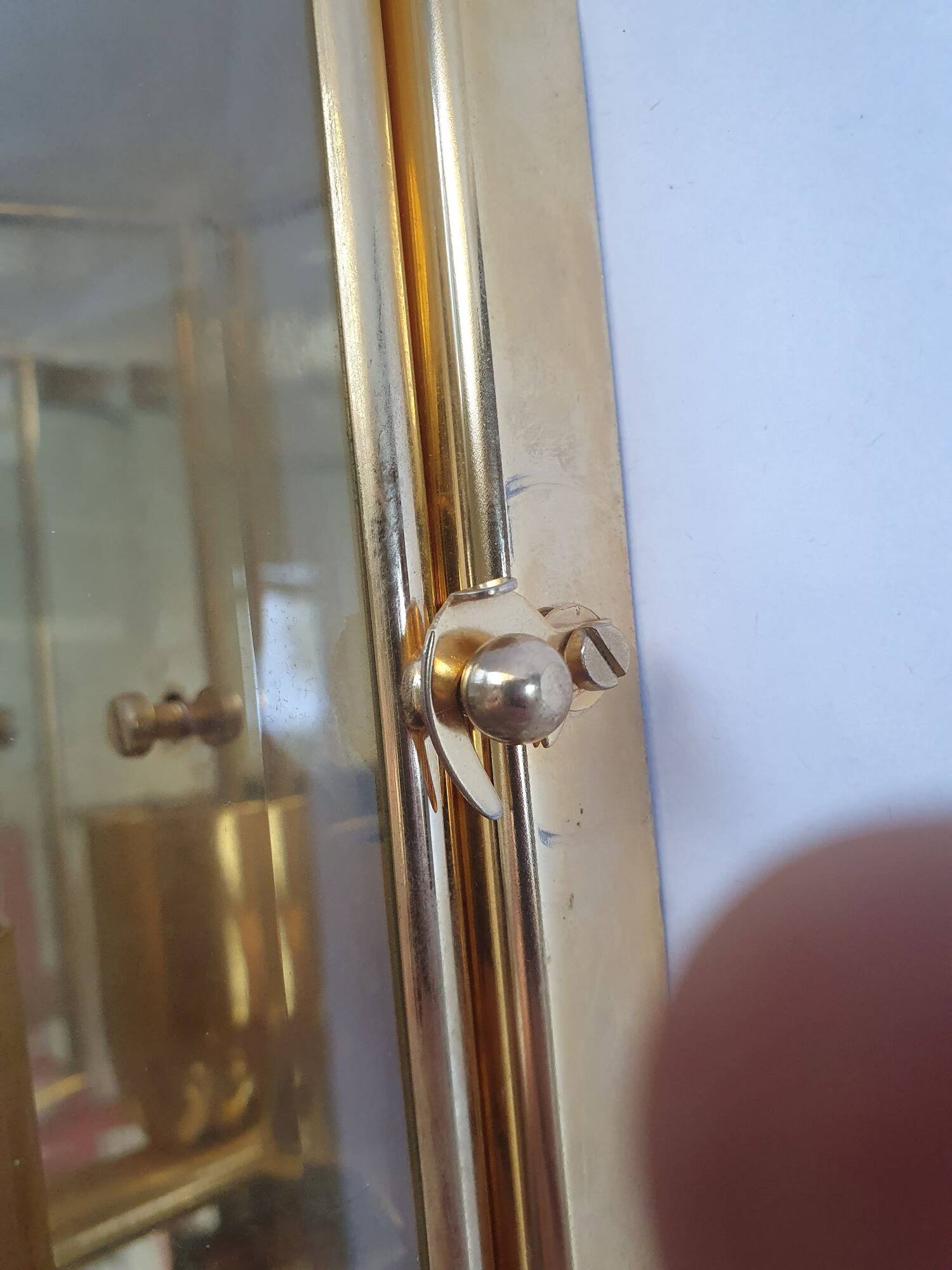 Pair of wall sconces in gold-plated brass with bevelled glass, Italian.