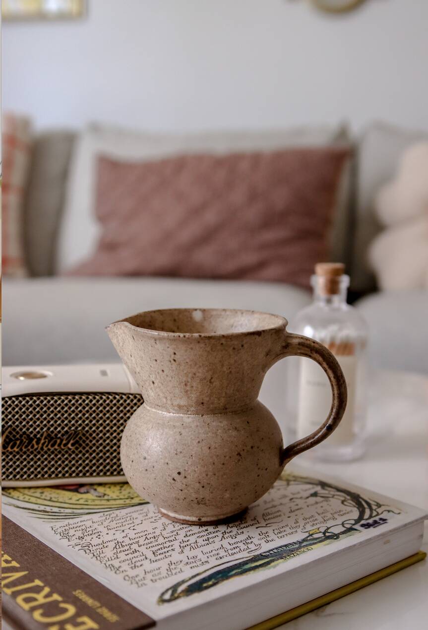Small pitcher in old speckled stoneware