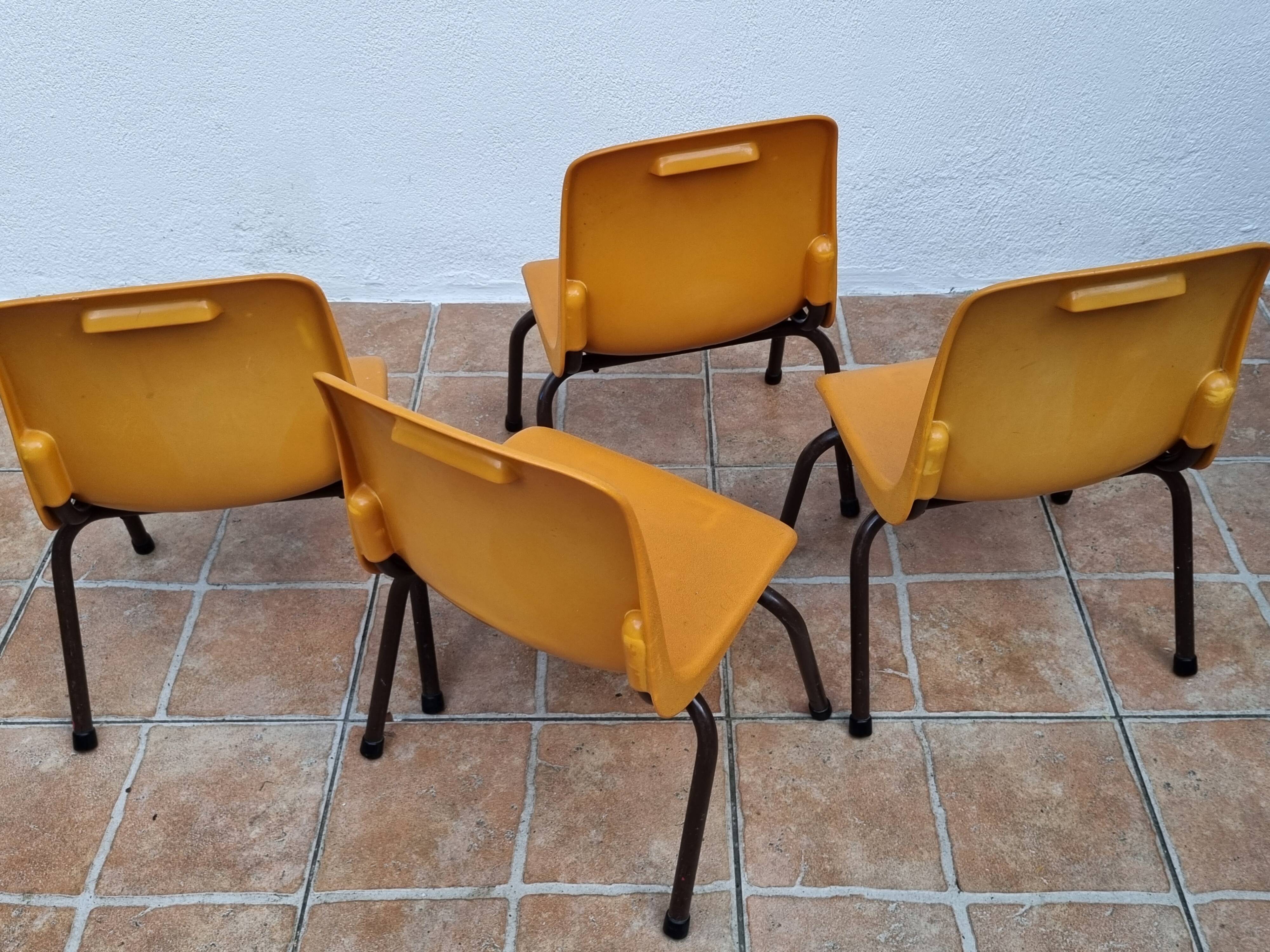 Set of 4 vintage Grosfillex school chairs, 60s-70s, orange plastic and tubular base