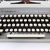 Remington travel-deter Deluxe typewriter with  case