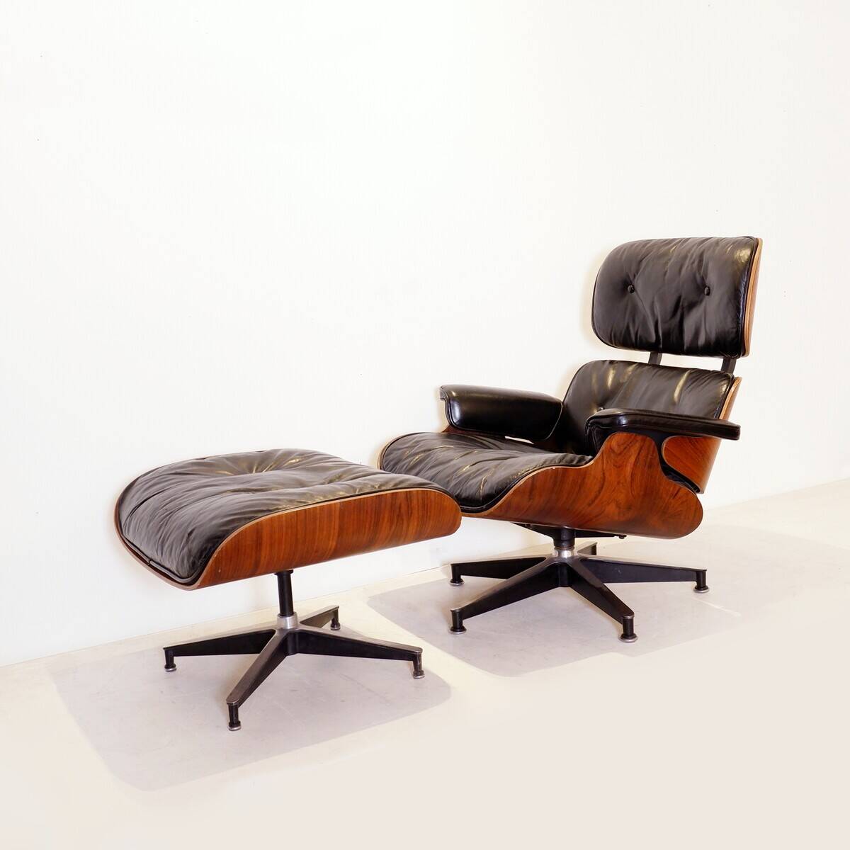 Mid-Century armchair and footrest by Charles & Ray Eames for Herman Miller