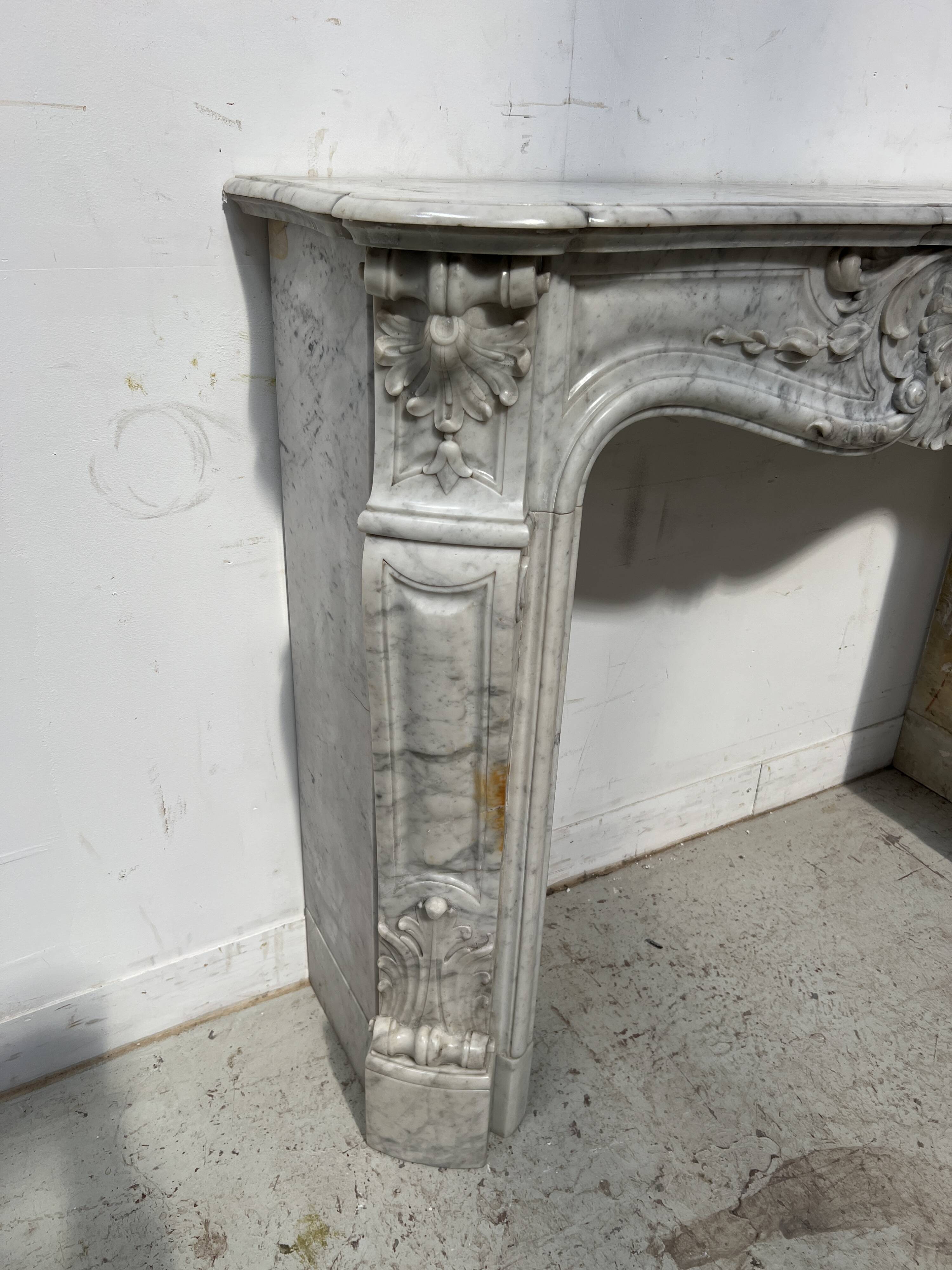 Louis XV style white Carrara marble fireplace, 19th century.