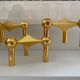 Series of 3 gold Nagel modular candlesticks