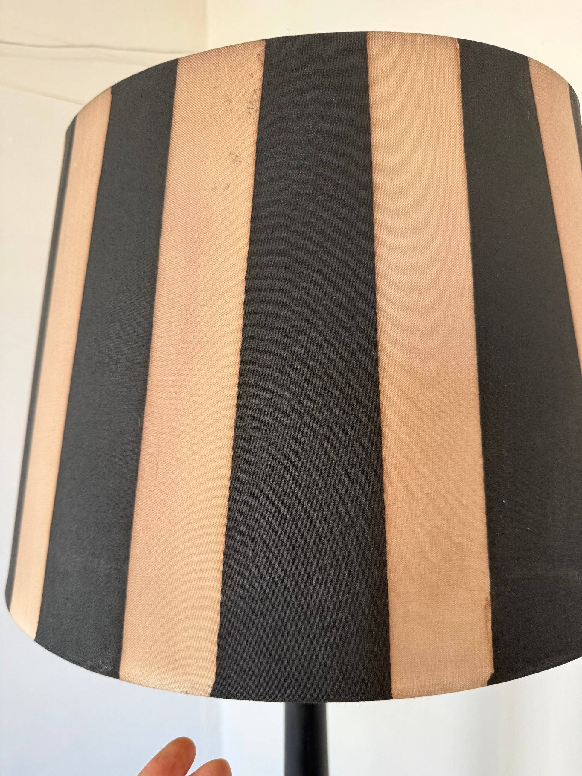 Vintage floor lamp in black patinated wood and striped lampshade
