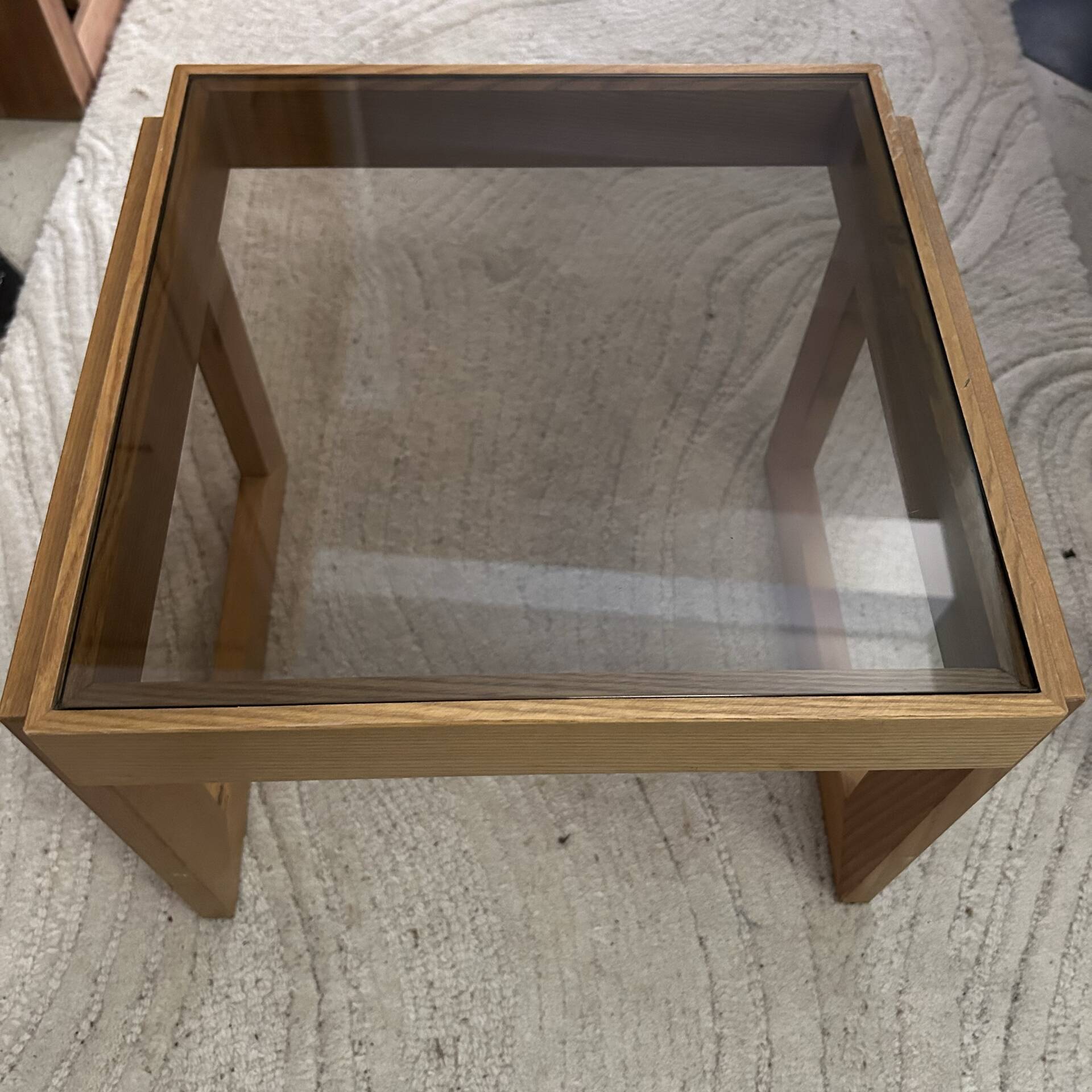 Modernist side table in wood and smoked glass