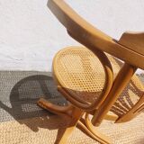 swivel armchair in wood and cane
