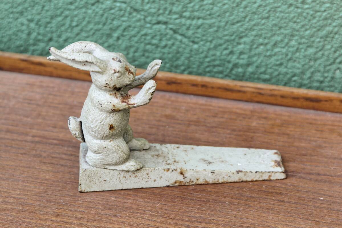 Old cast iron rabbit door wedge