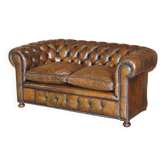 Restored leather Chesterfield sofa, walnut legs.