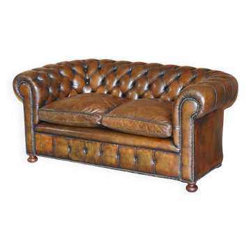 Restored leather Chesterfield sofa, walnut legs.