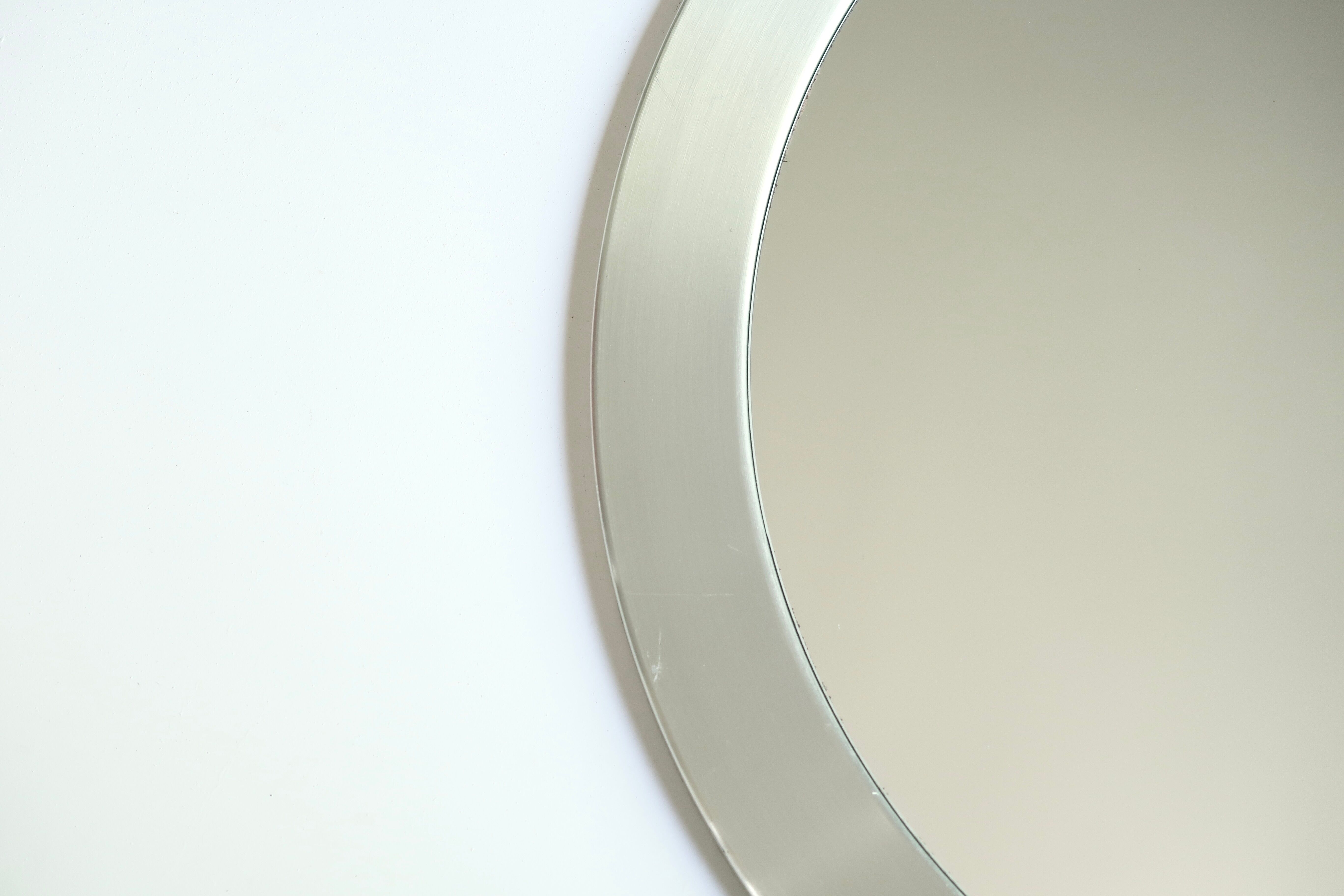 Round brushed aluminium mirror, 1970s