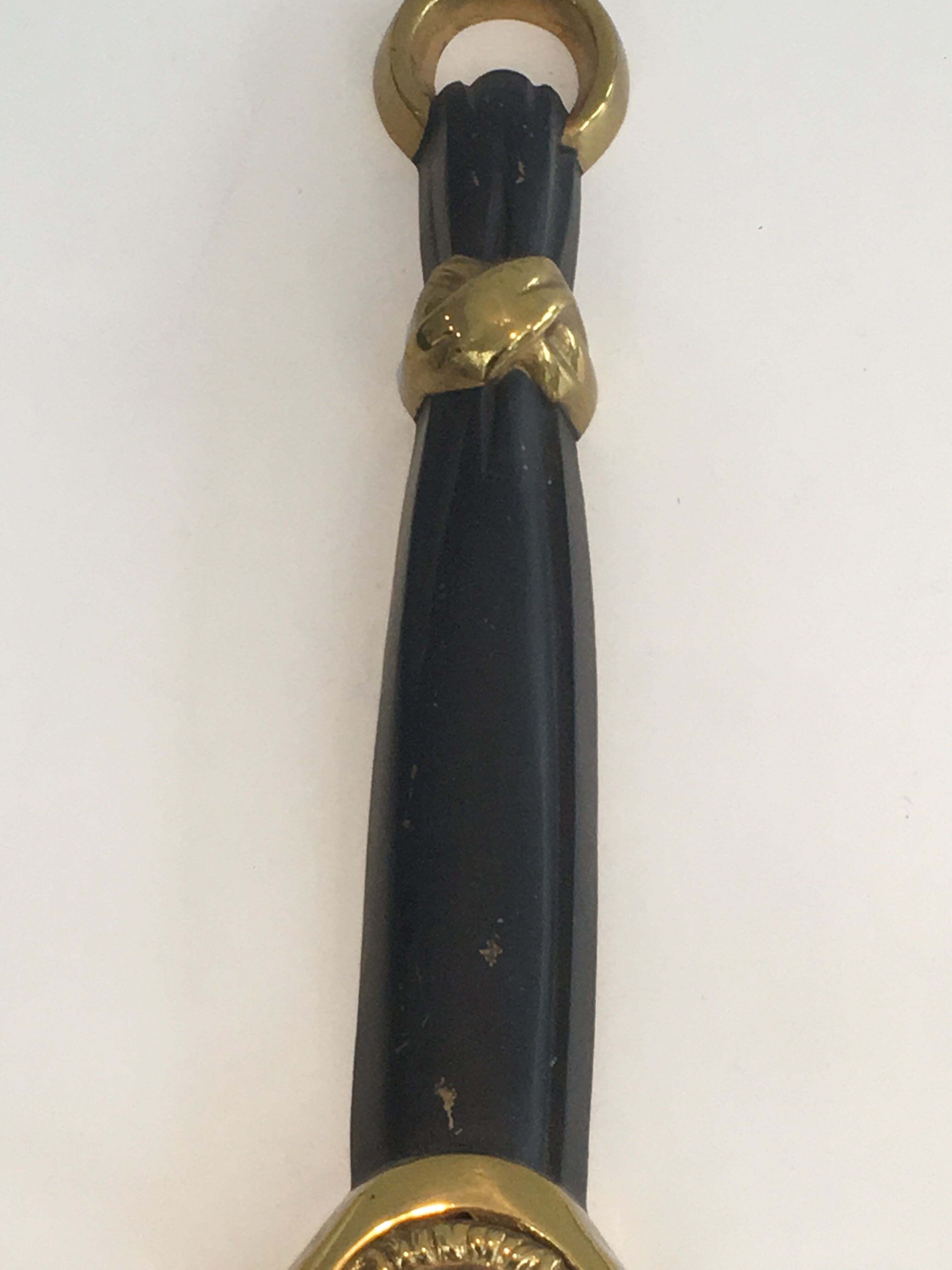 Pair of Black Lacquered Bronze Wall Lamps with Lions' Head Decorations. Around 1970