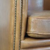 Sheep leather club chair in neutral cognac colour and in good condition