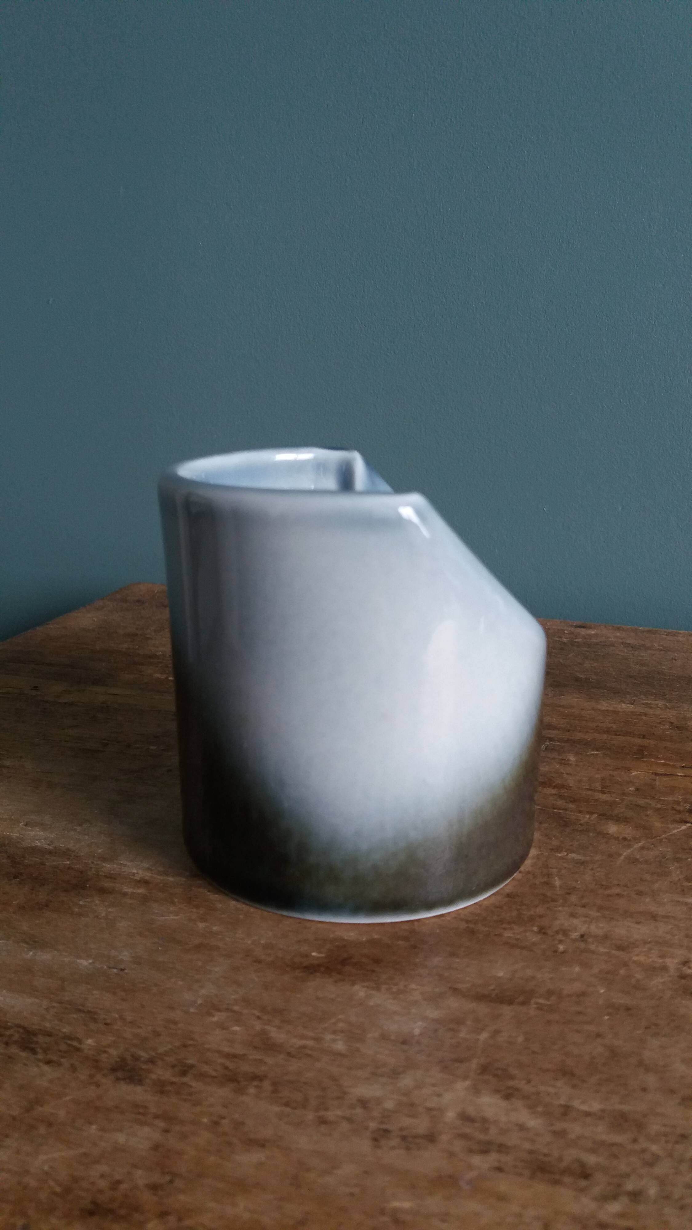 Vase Virebent porcelain cylindrical roll shape with a deep neck.