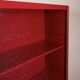 Double-face rotating display cabinet in red lacquer by Arflex, 1980s