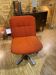 Orange 70s swivel armchairs