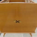 Art Deco baby with its wooden compass feet