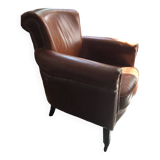 Industrial style aged leather armchair