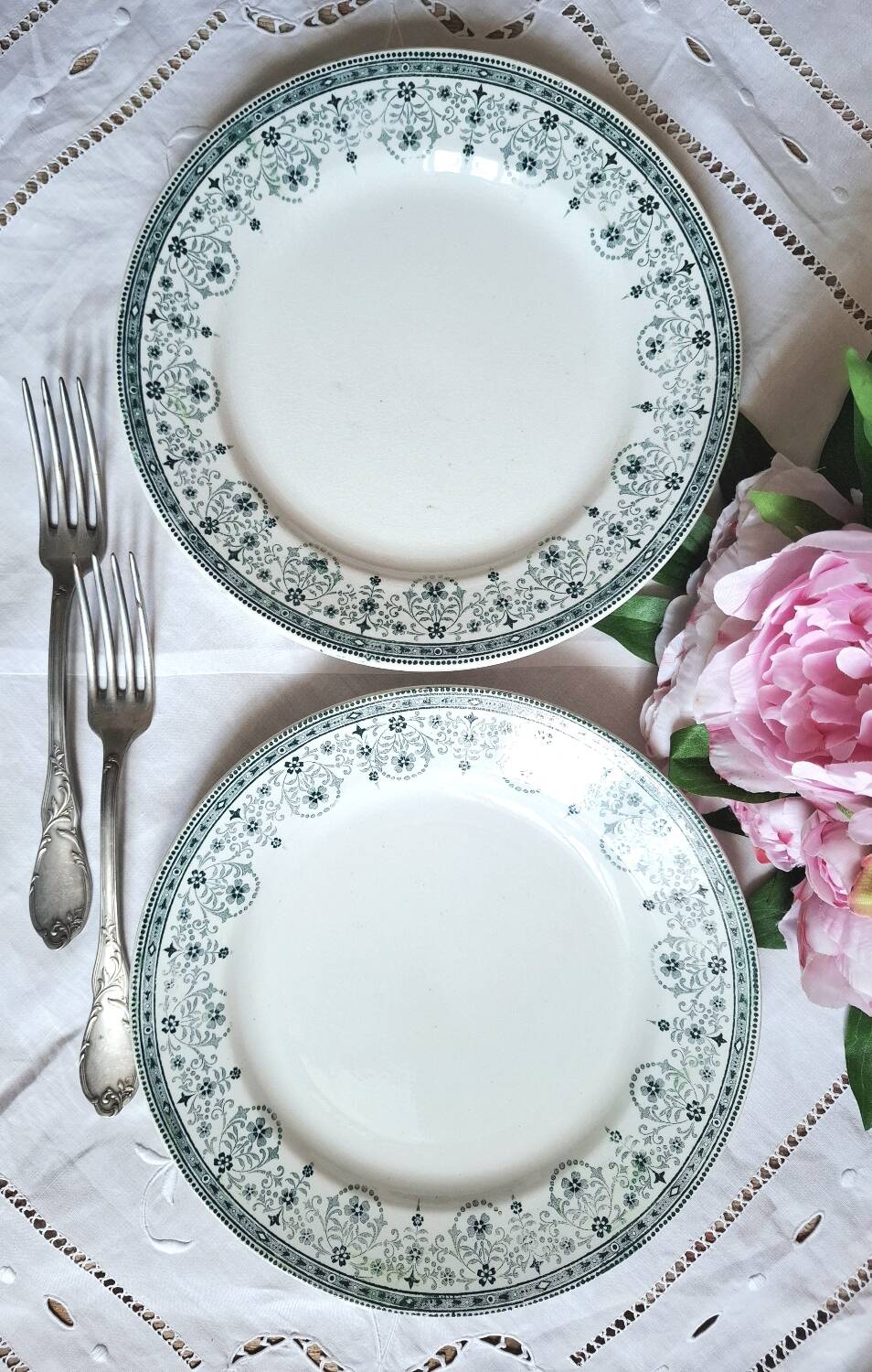 Mismatched antique flat plates made of ironstone accompanied by