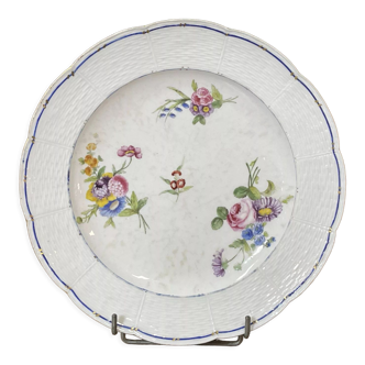 Plate in porcelain of Sèvres with polychrome decoration of flowers of the eighteenth century