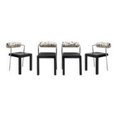Ensemble de quatre chaises italiennes éditées par Saporiti. Dossier en jacquard et assise en cuir.