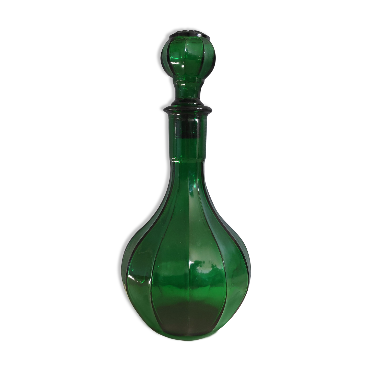 Old green carafe with ribbed lines