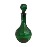 Old green carafe with ribbed lines
