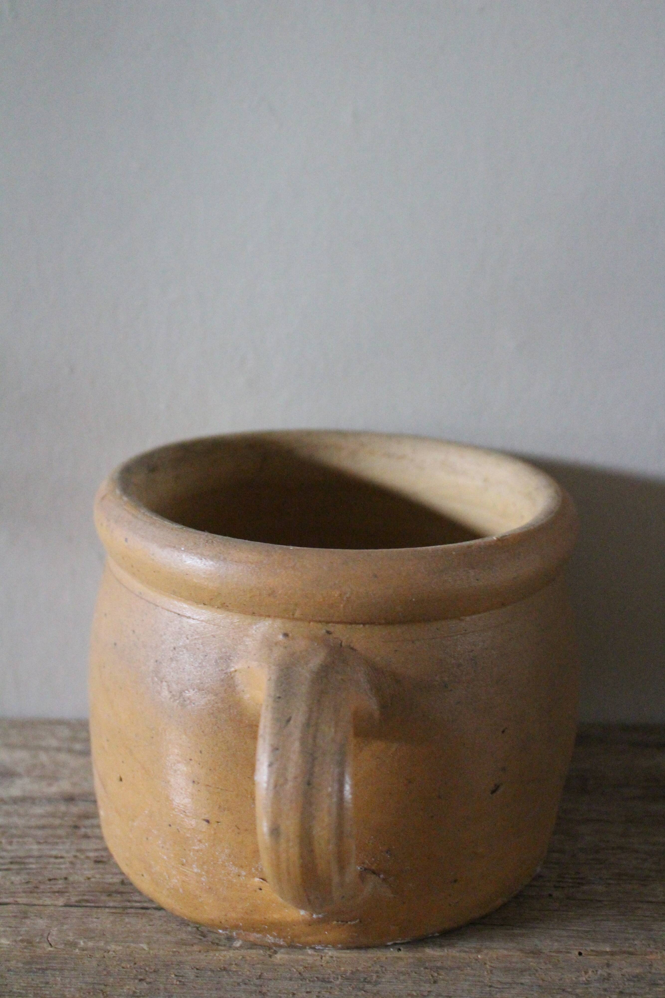 Round terracotta milk jug with handle