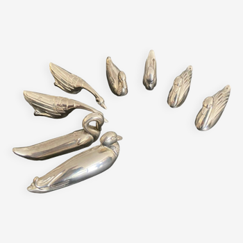 8 porte-couteaux animaux variés en métal couleur argent