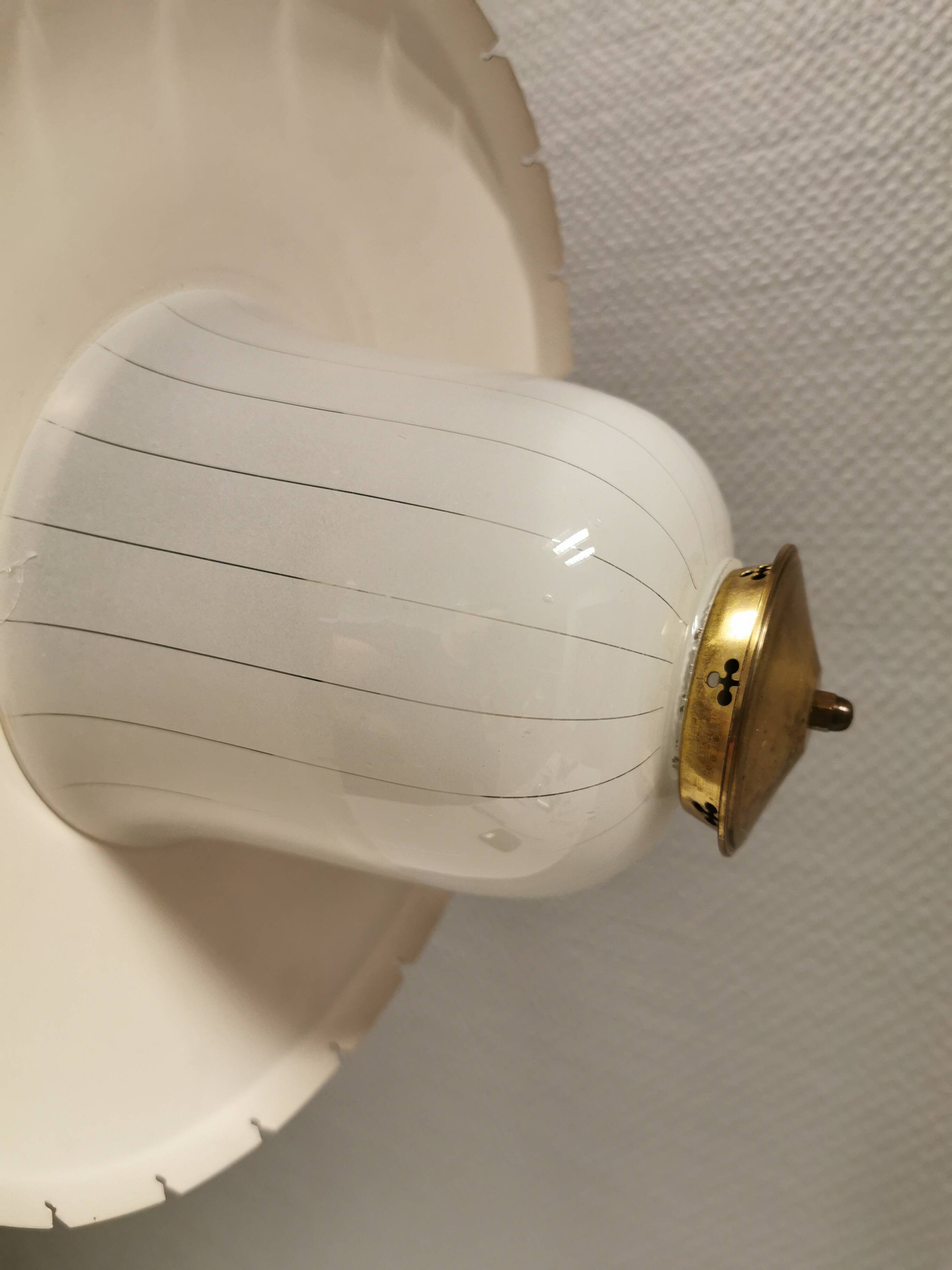 Hanging lamp in glass with black lacquered metal shade and brass base.