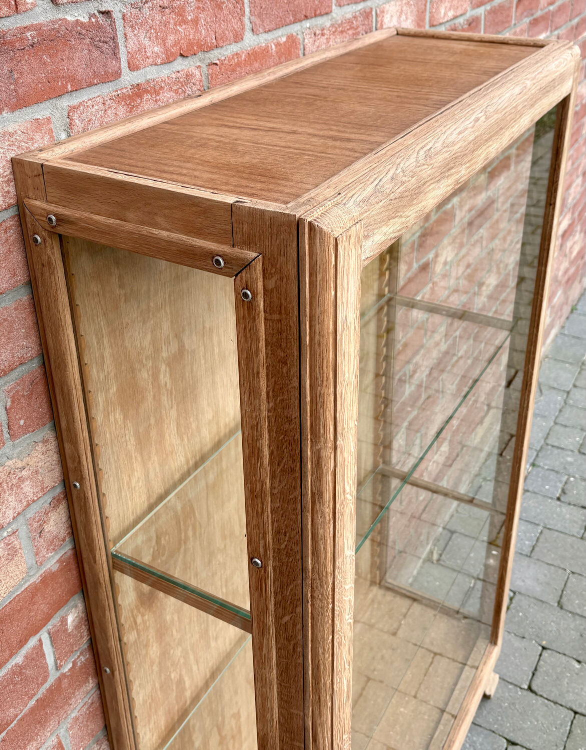 Restored antique oak display cabinet with glass shelves.