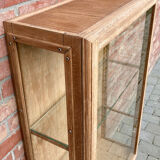 Restored antique oak display cabinet with glass shelves.