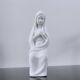Vintage white plaster statuette of the Virgin Mary.