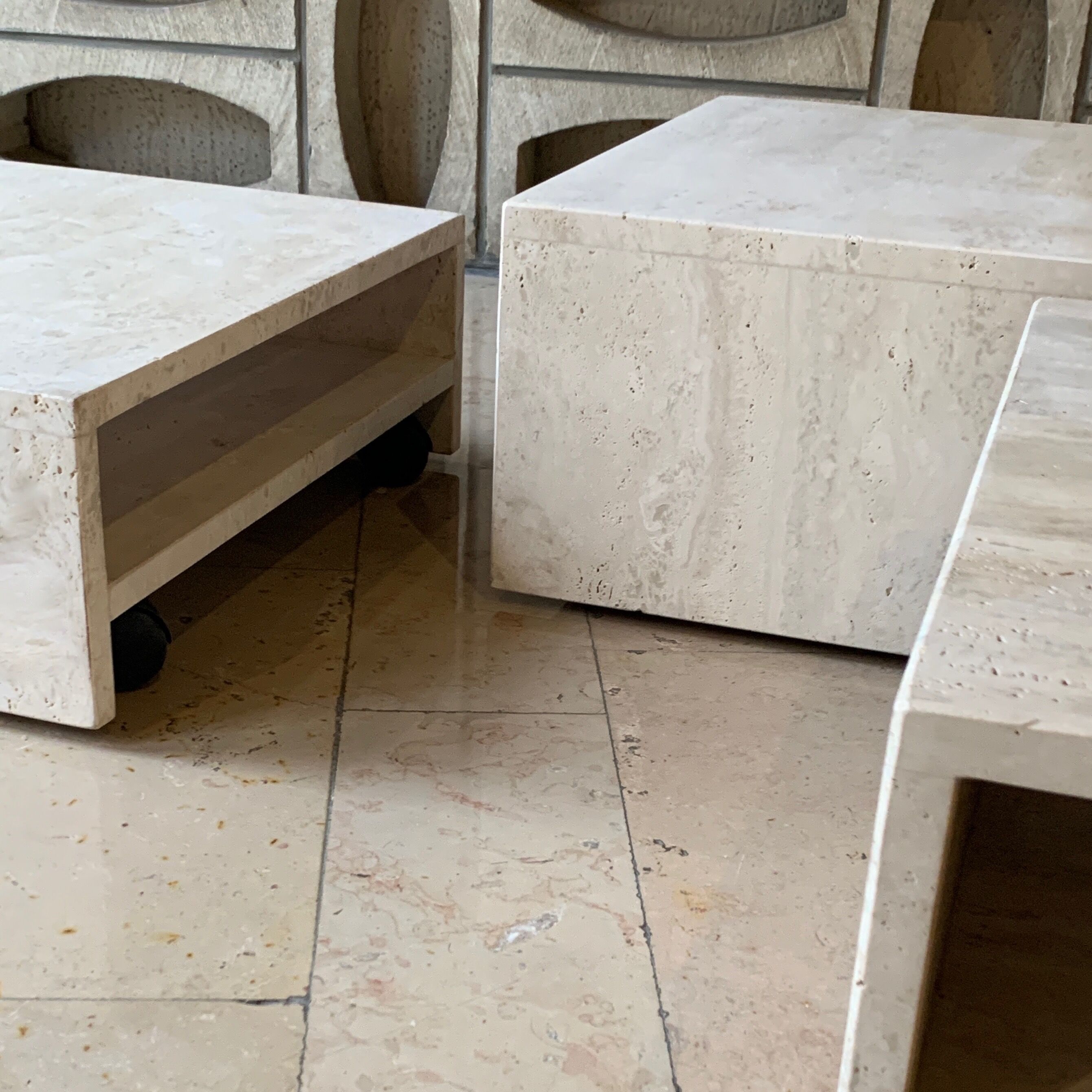 Modular square coffee tables in softened travertine