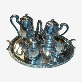 silver metal coffee service with shell model tray