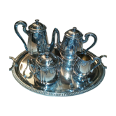Silver metal coffee service with shell-shaped tray