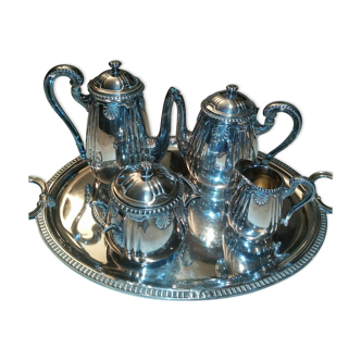 silver metal coffee service with shell model tray