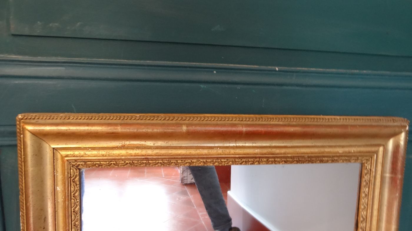 Empire period mirror, early nineteenth in gilded stucco wood H 72 cm