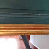 Empire period mirror, early nineteenth in gilded stucco wood H 72 cm