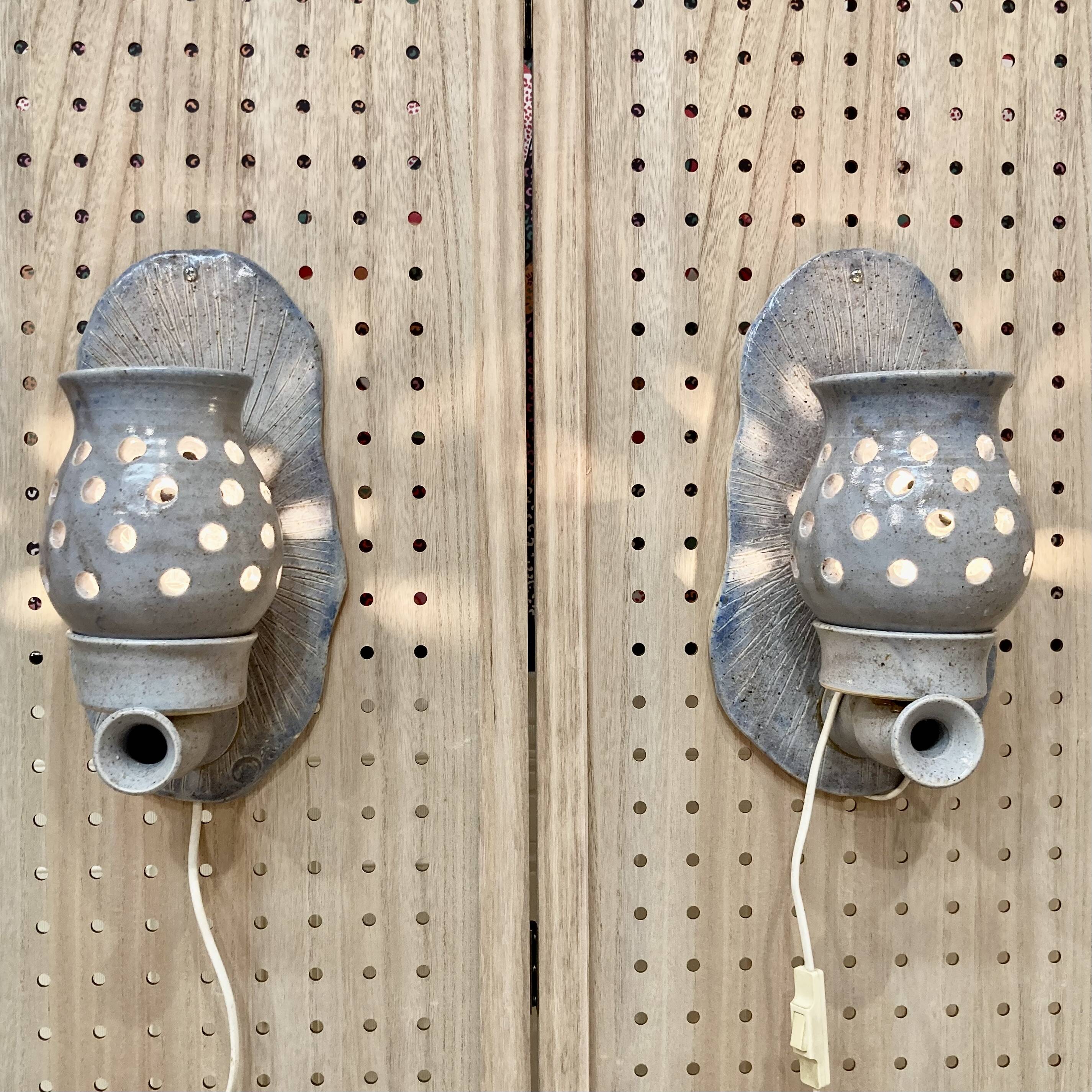 Pair of enamelled terracotta wall lights 1960.