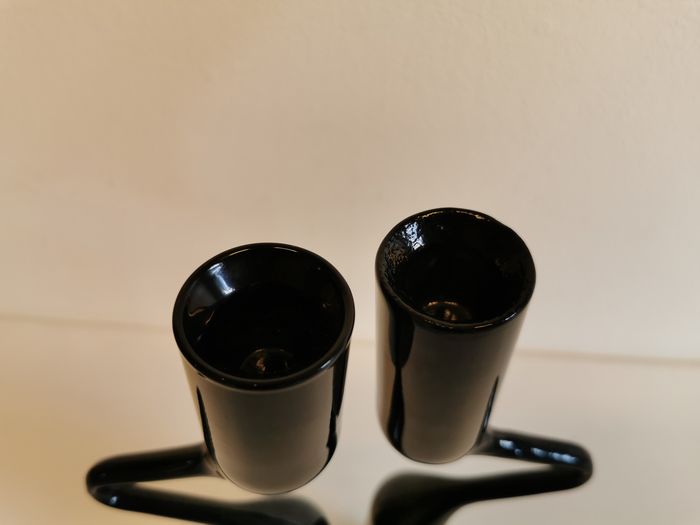 Set of two black design candlesticks, designed by mikaela dörfel for menu, denmark.