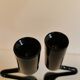 Set of two black design candlesticks, designed by mikaela dörfel for menu, denmark.