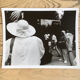 Photograph.woman with hat at funfair, 90s