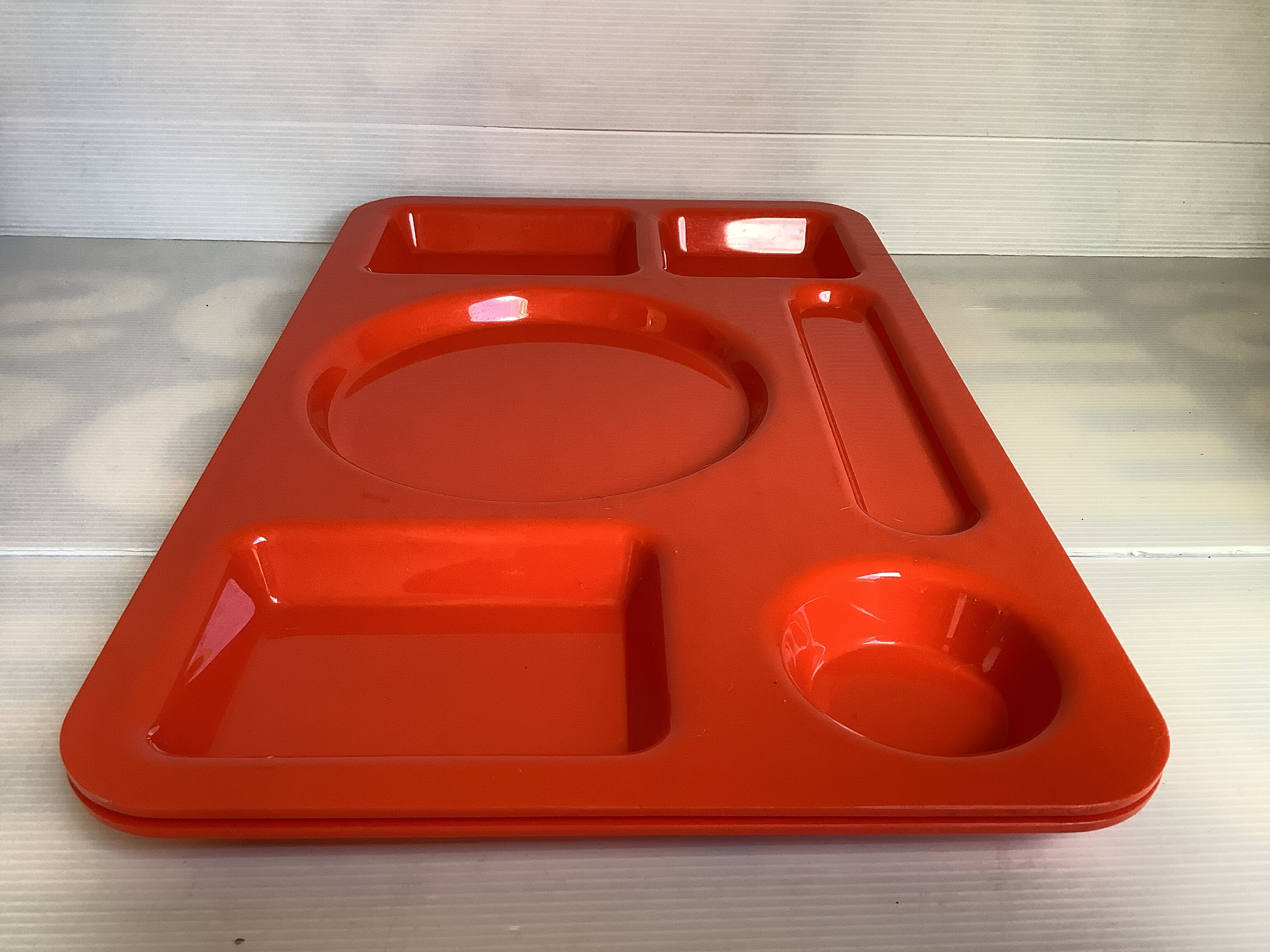 Pair of orange guzzini meal trays