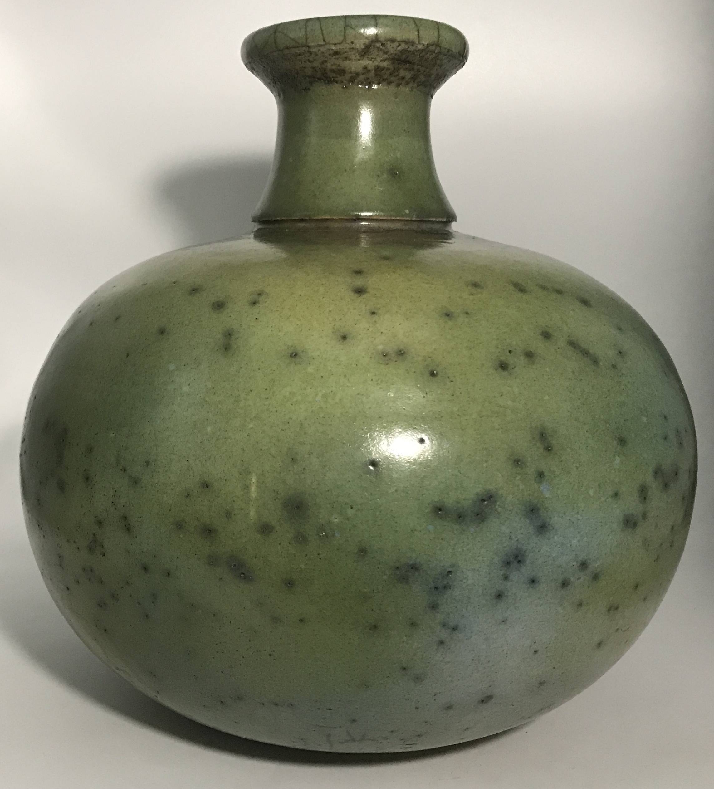 Contemporary vase ball shape raku shades of green and yellow