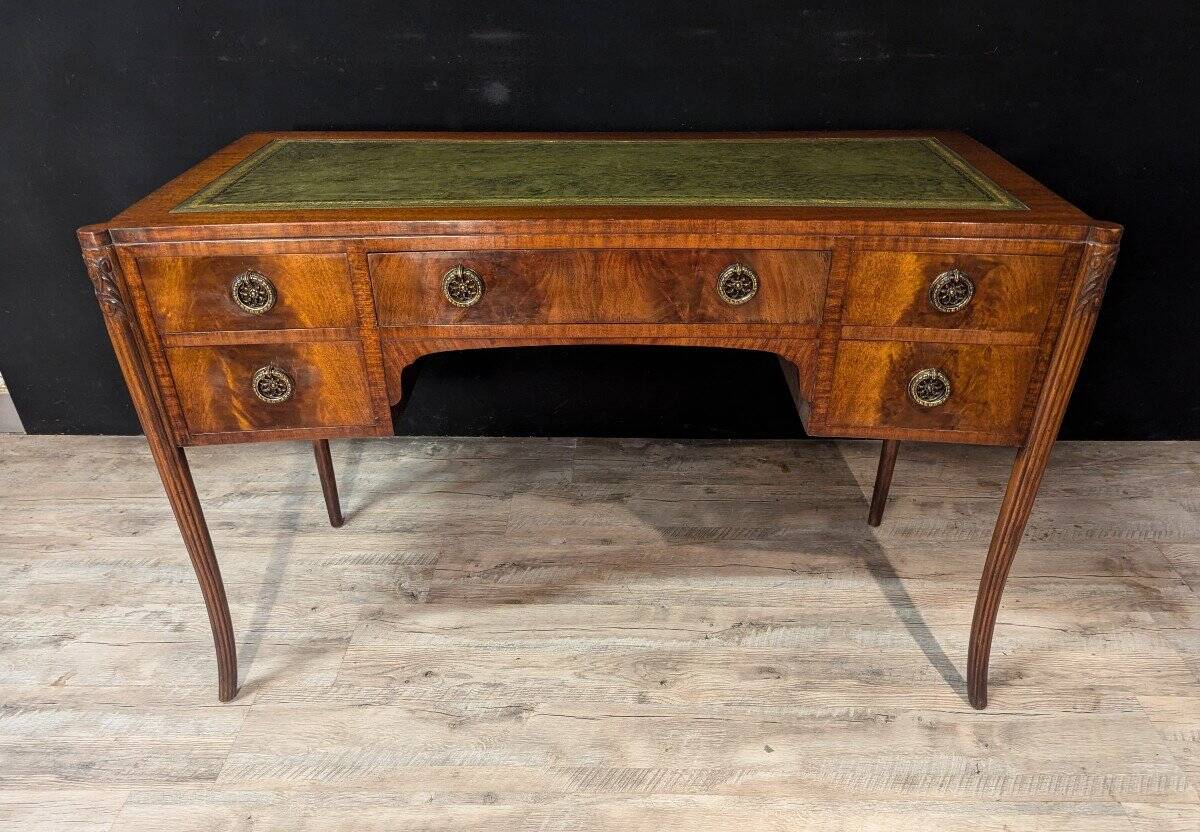 Art Deco desk in curved mahogany veneer.
