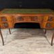 Art Deco desk in curved mahogany veneer.