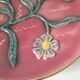 Large antique plate in floral slip with hand-painted relief decoration